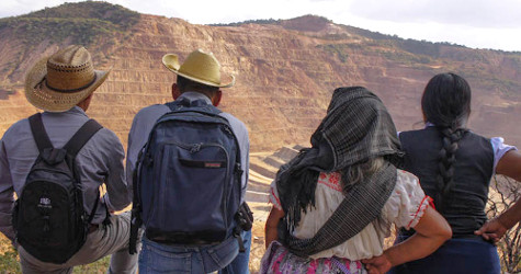 Community members look on Los Filos open pit mine in Guerrero, Mexico.